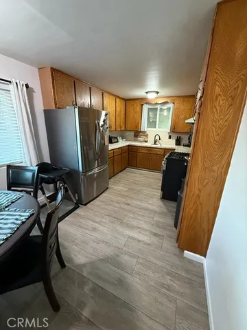 a view of a livingroom with furniture and a window