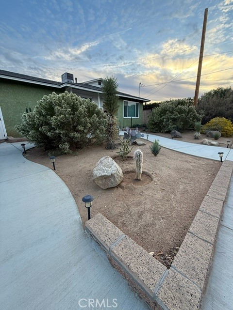 4552 West Ave L12 Lancaster, CA 93536 - Photo 37 of 39 a view of a backyard with sitting area
