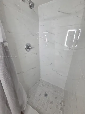 a bathroom with a sink toilet and mirror