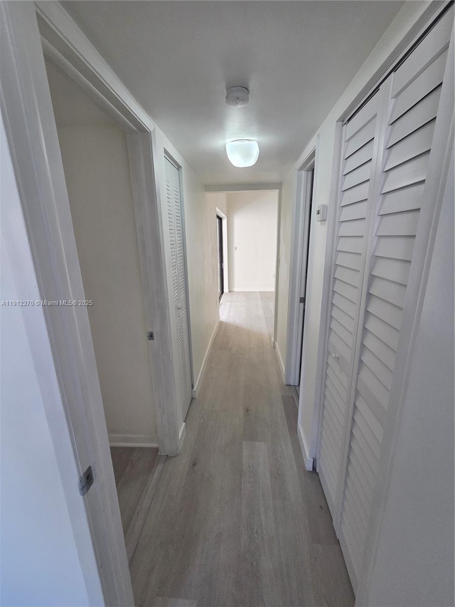 9433 Fontainebleau Boulevard, Unit 212 Miami, FL 33172 - Photo 31 of 45 a view of a hallway