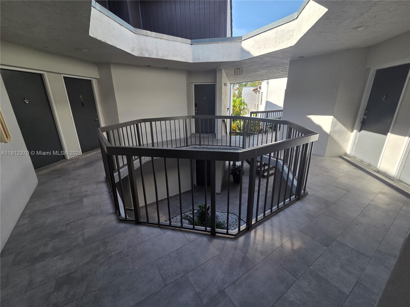 9433 Fontainebleau Boulevard, Unit 212 Miami, FL 33172 - Photo 33 of 45 a view of entryway with wooden floor