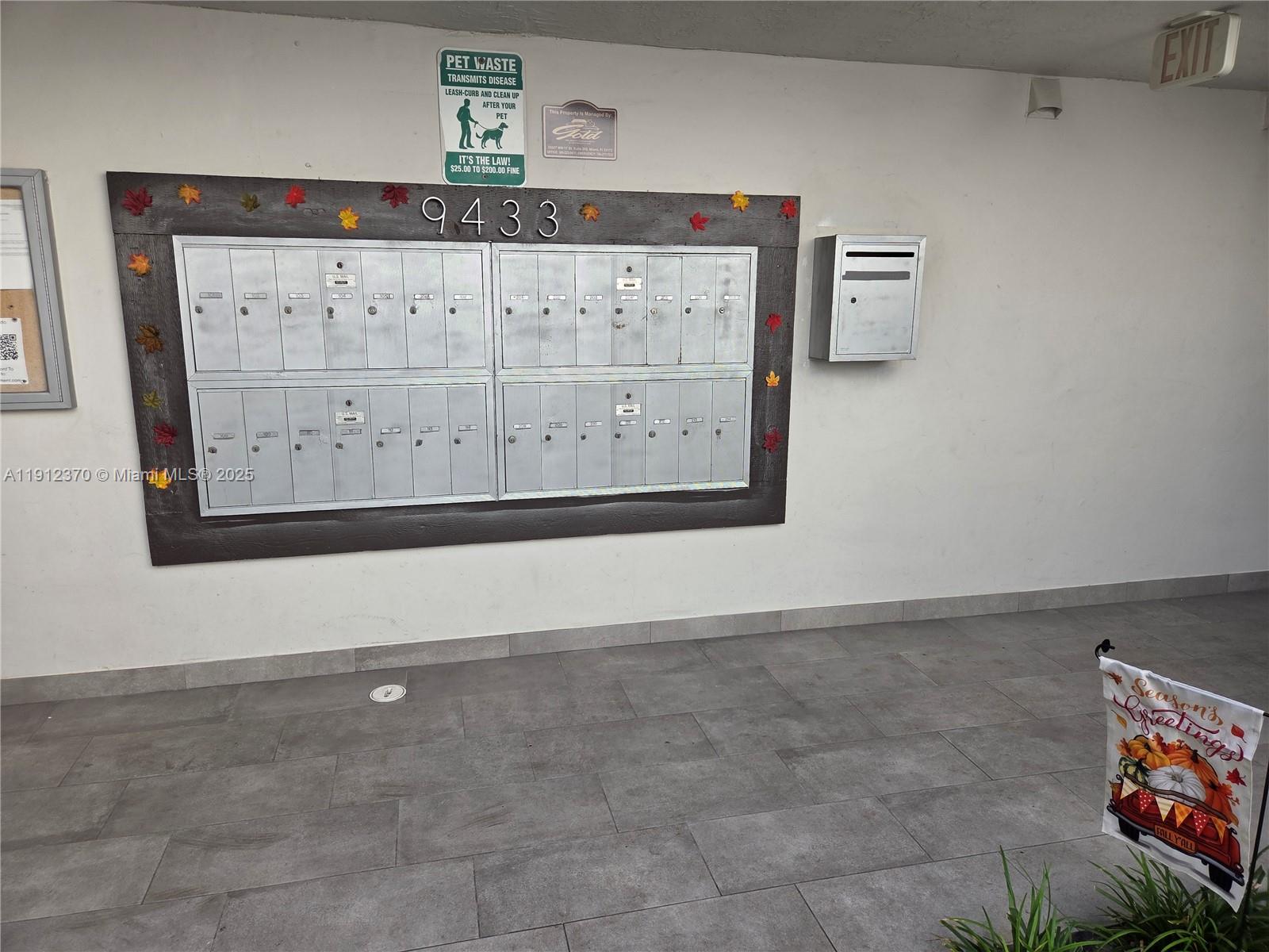 9433 Fontainebleau Boulevard, Unit 212 Miami, FL 33172 - Photo 36 of 45 a view of a hallway with paintings on the wall