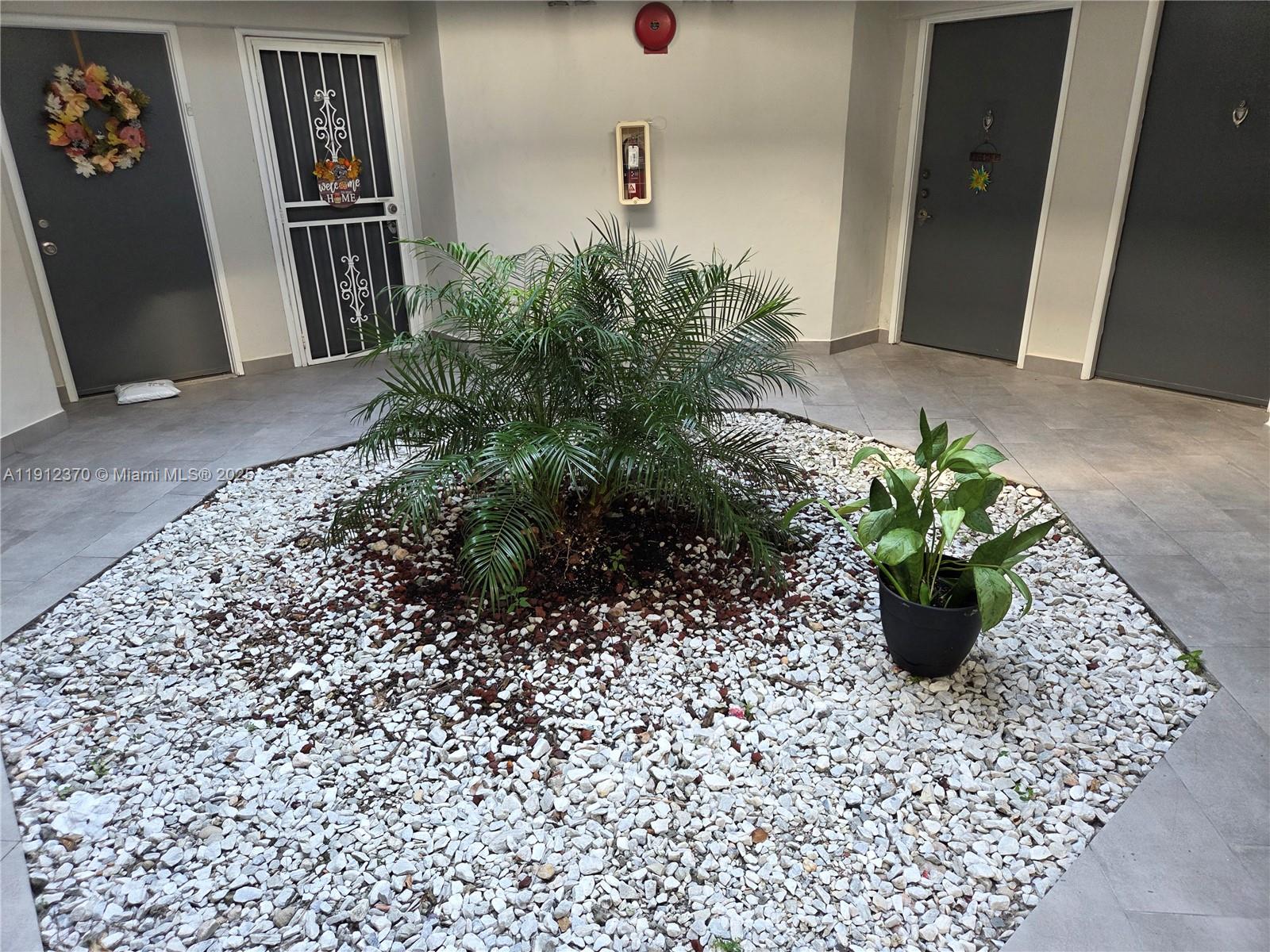 9433 Fontainebleau Boulevard, Unit 212 Miami, FL 33172 - Photo 38 of 45 a vase of flowers sitting on a table