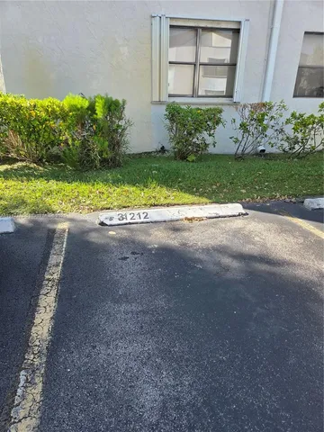 a balcony with table and chairs