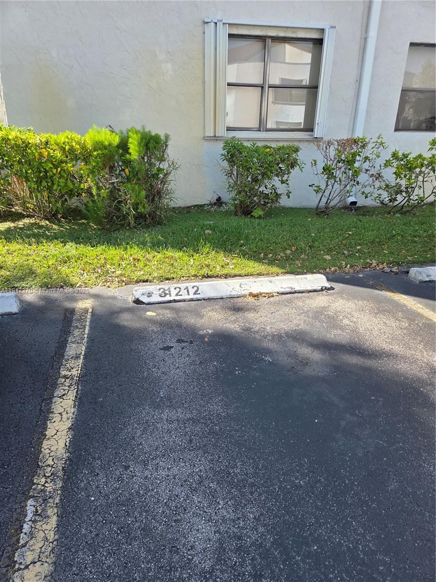 9433 Fontainebleau Boulevard, Unit 212 Miami, FL 33172 - Photo 40 of 45 a house with a yard