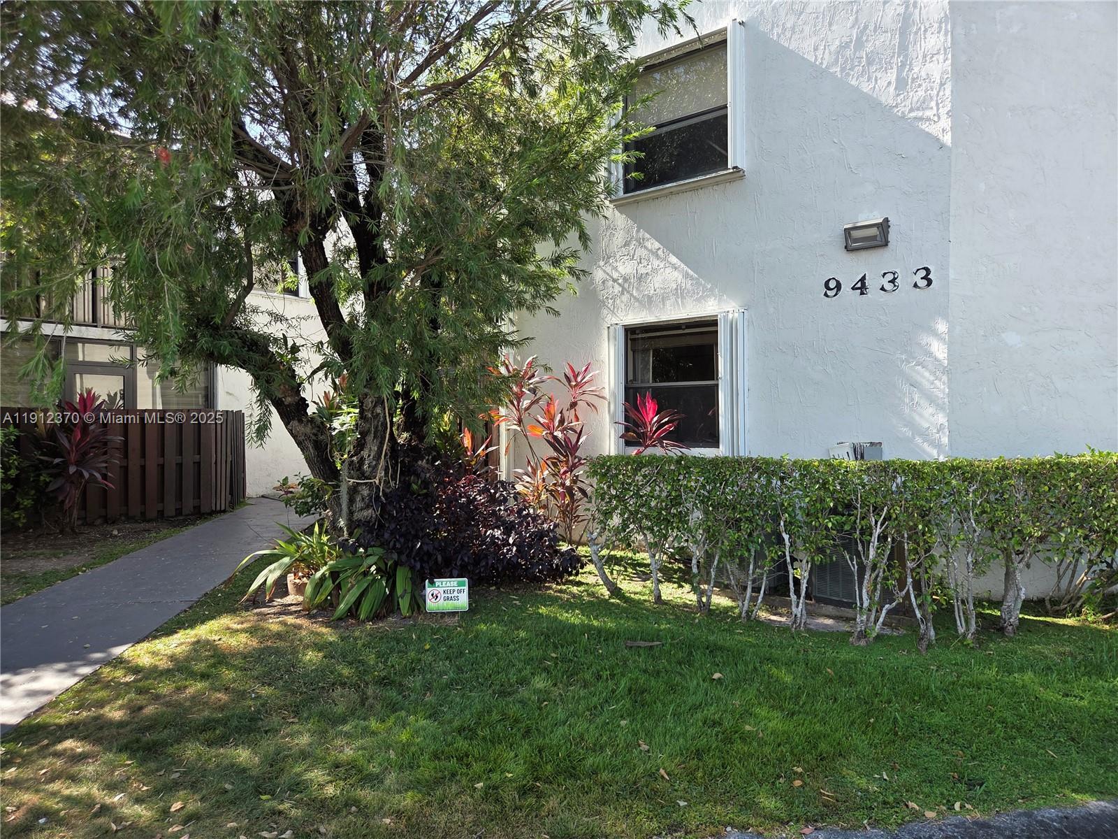 9433 Fontainebleau Boulevard, Unit 212 Miami, FL 33172 - Photo 42 of 45 a front view of a house with garden