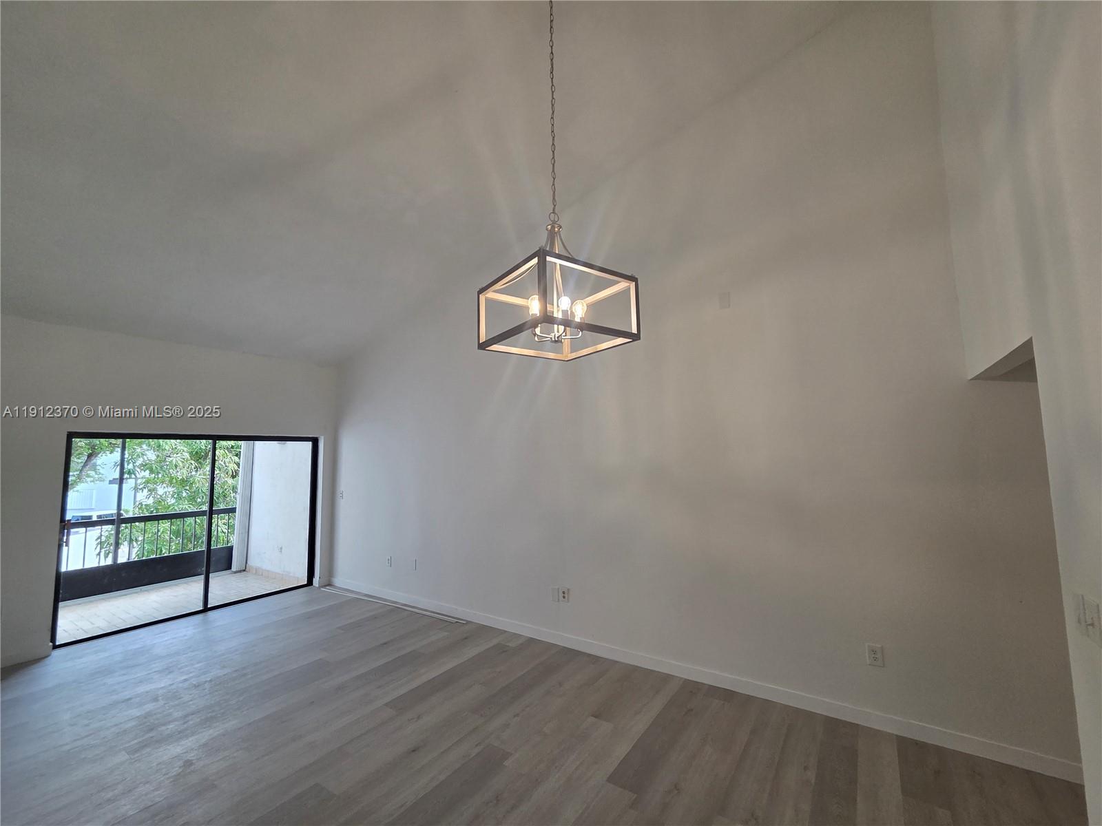 9433 Fontainebleau Boulevard, Unit 212 Miami, FL 33172 - Photo 7 of 45 a view of a room with wooden floor and window