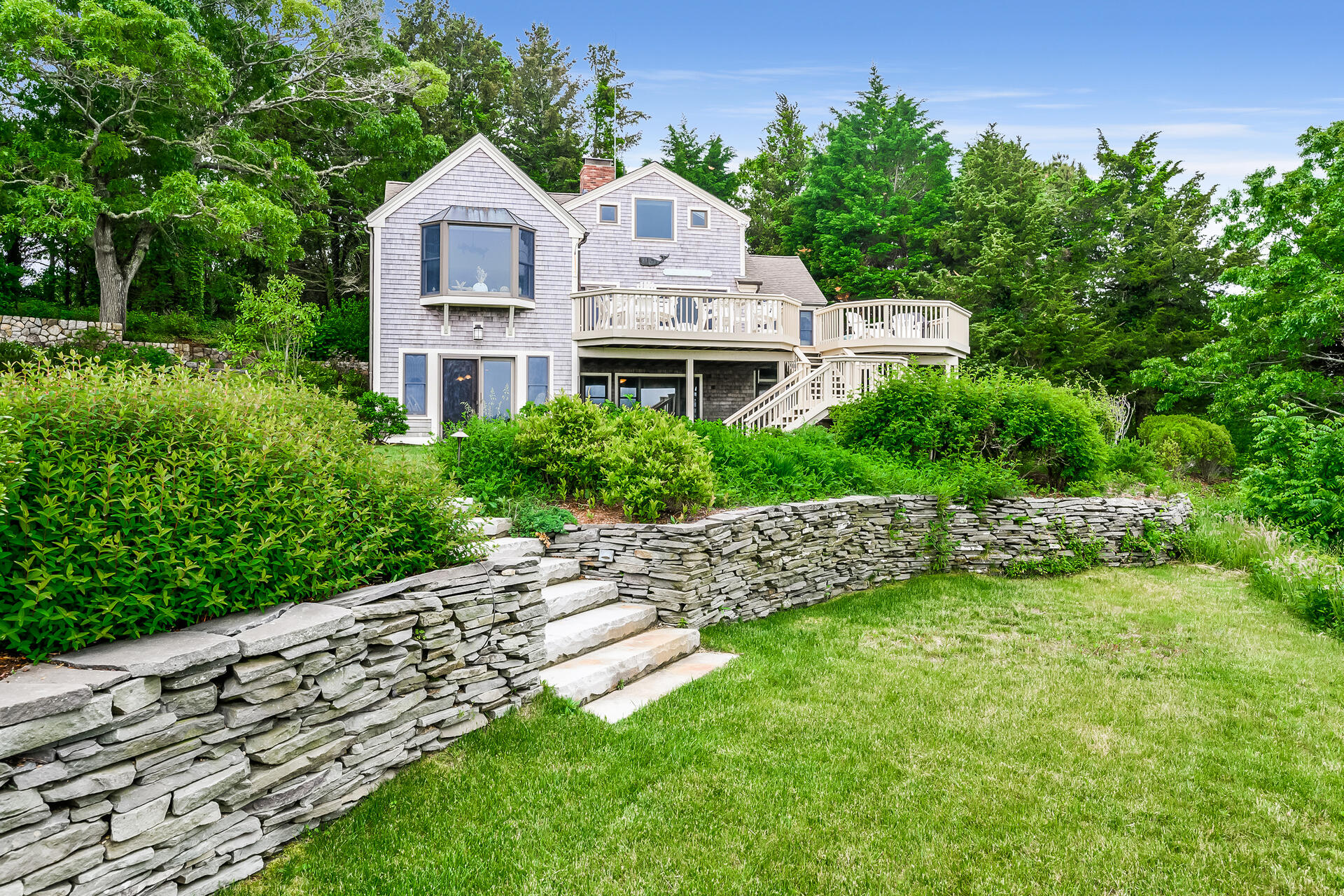 33 Ruggles Road Orleans, MA 02653 - Photo 2 of 80 a front view of a house with a yard