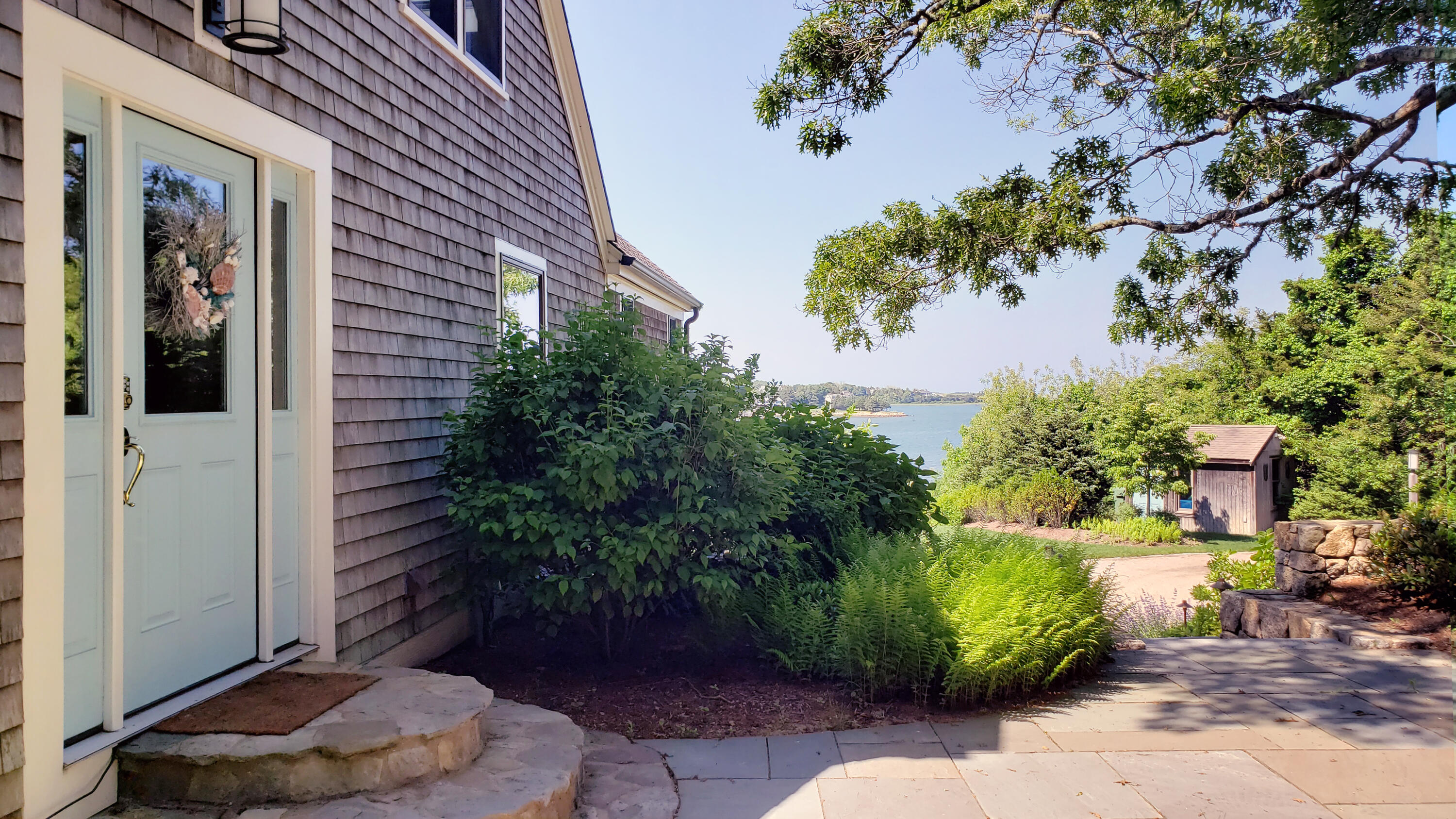 33 Ruggles Road Orleans, MA 02653 - Photo 3 of 80 a potted plant sitting in front of a house