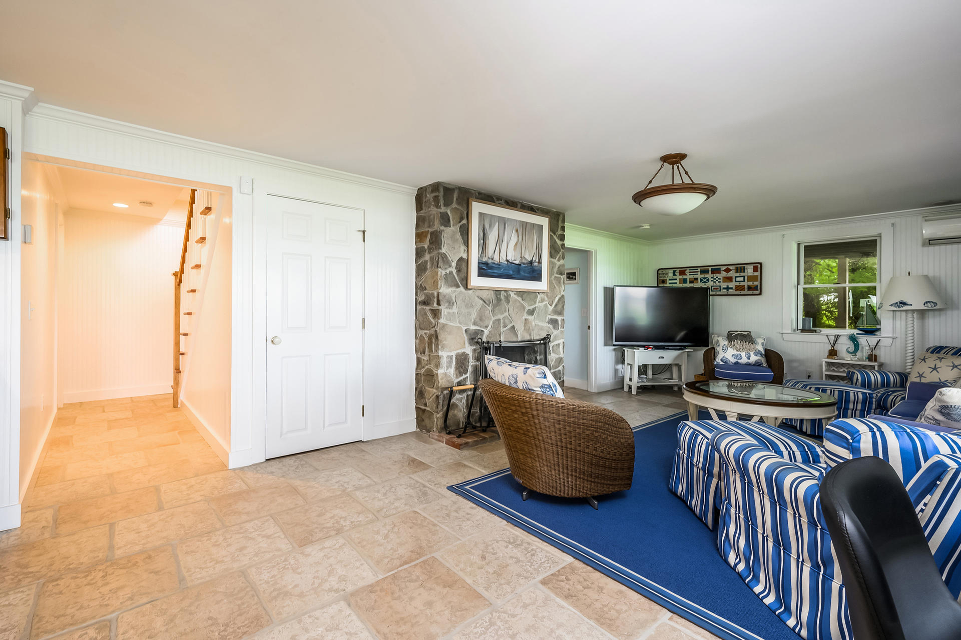 33 Ruggles Road Orleans, MA 02653 - Photo 38 of 80 a living room with furniture and a flat screen tv