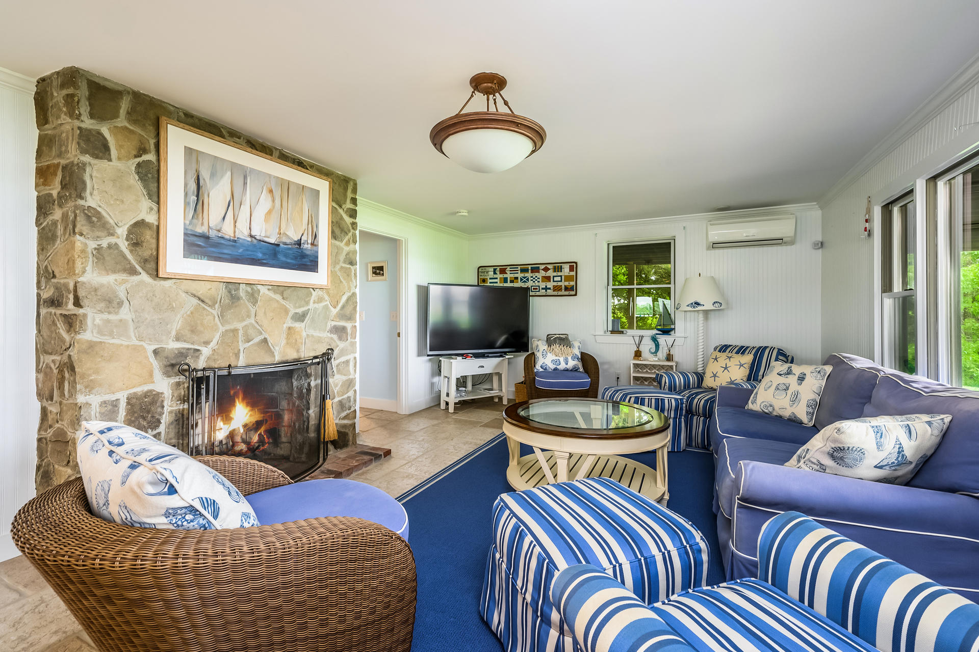 33 Ruggles Road Orleans, MA 02653 - Photo 39 of 80 a living room with furniture and a fireplace