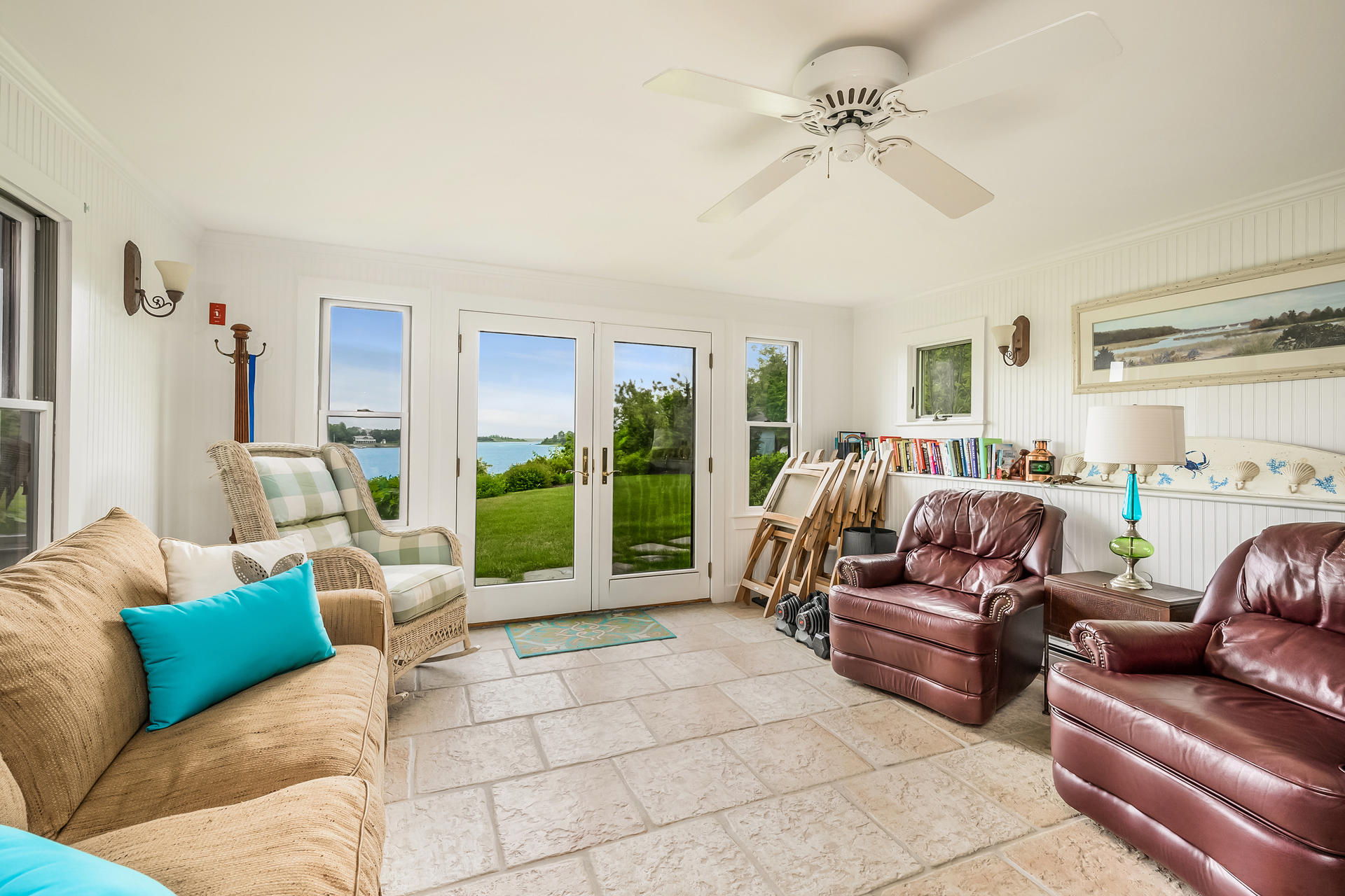 33 Ruggles Road Orleans, MA 02653 - Photo 46 of 80 a living room with furniture ceiling fan and a rug
