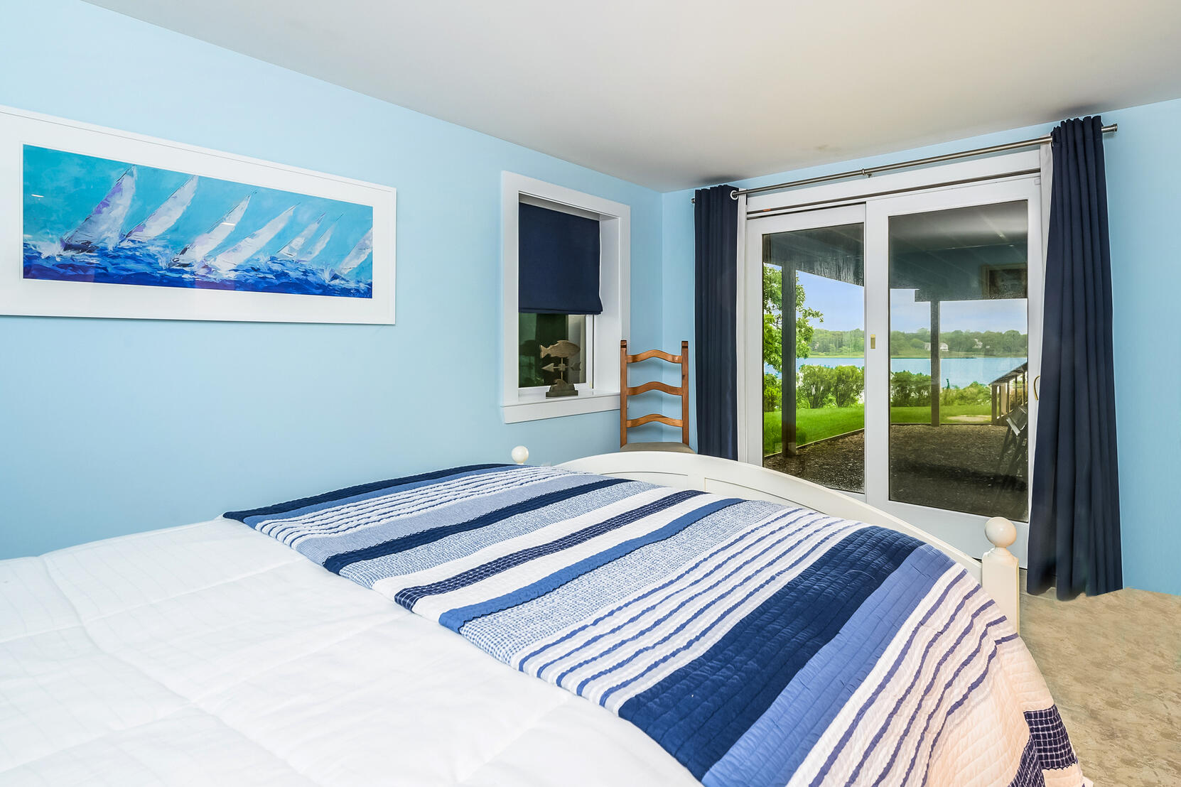 33 Ruggles Road Orleans, MA 02653 - Photo 47 of 80 a bedroom with a bed and a large window