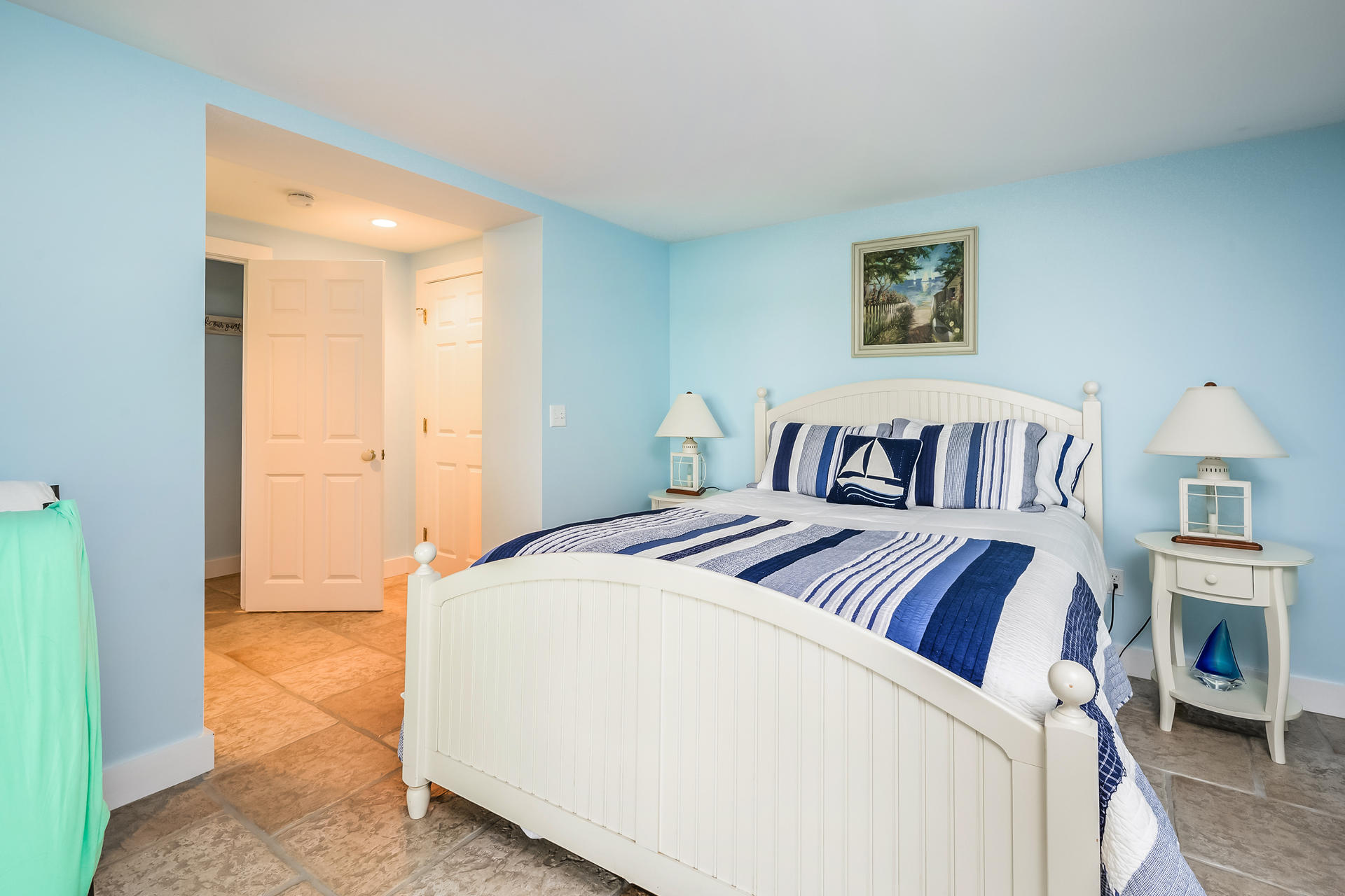 33 Ruggles Road Orleans, MA 02653 - Photo 48 of 80 a bedroom with a large bed and a chandelier