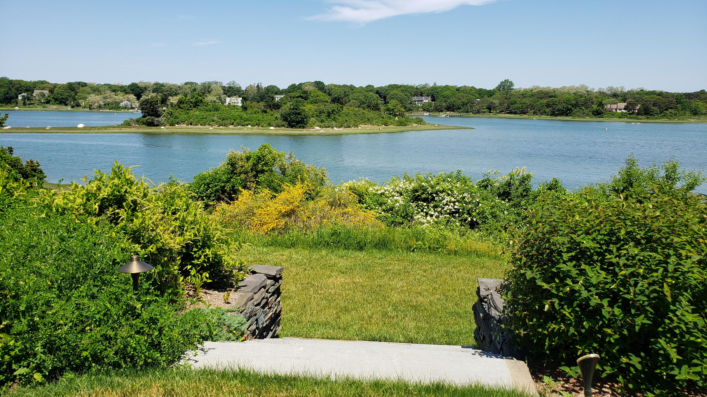 33 Ruggles Road Orleans, MA 02653 - Photo 56 of 80 a view of a lake with houses in the back