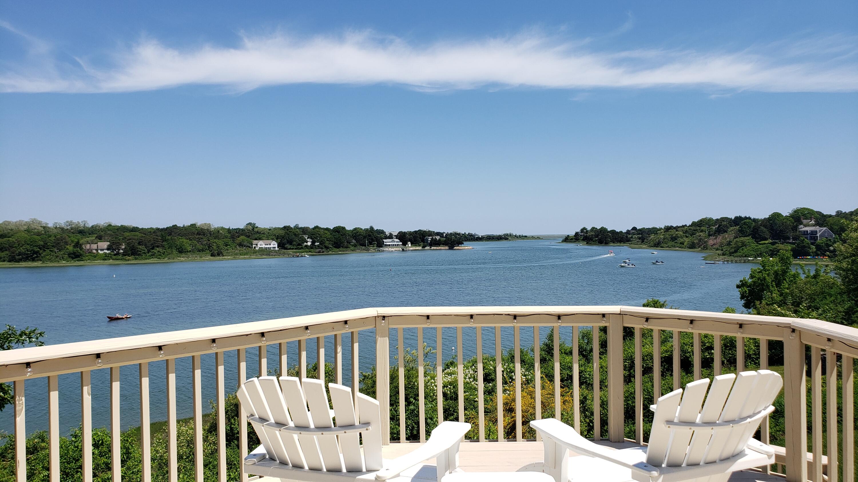 33 Ruggles Road Orleans, MA 02653 - Photo 57 of 80 a view of a balcony with wooden floor and lake view