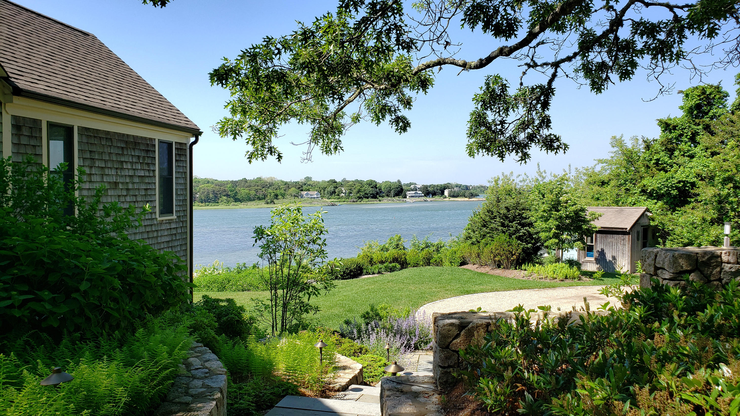33 Ruggles Road Orleans, MA 02653 - Photo 61 of 80 a view of a garden with a lake