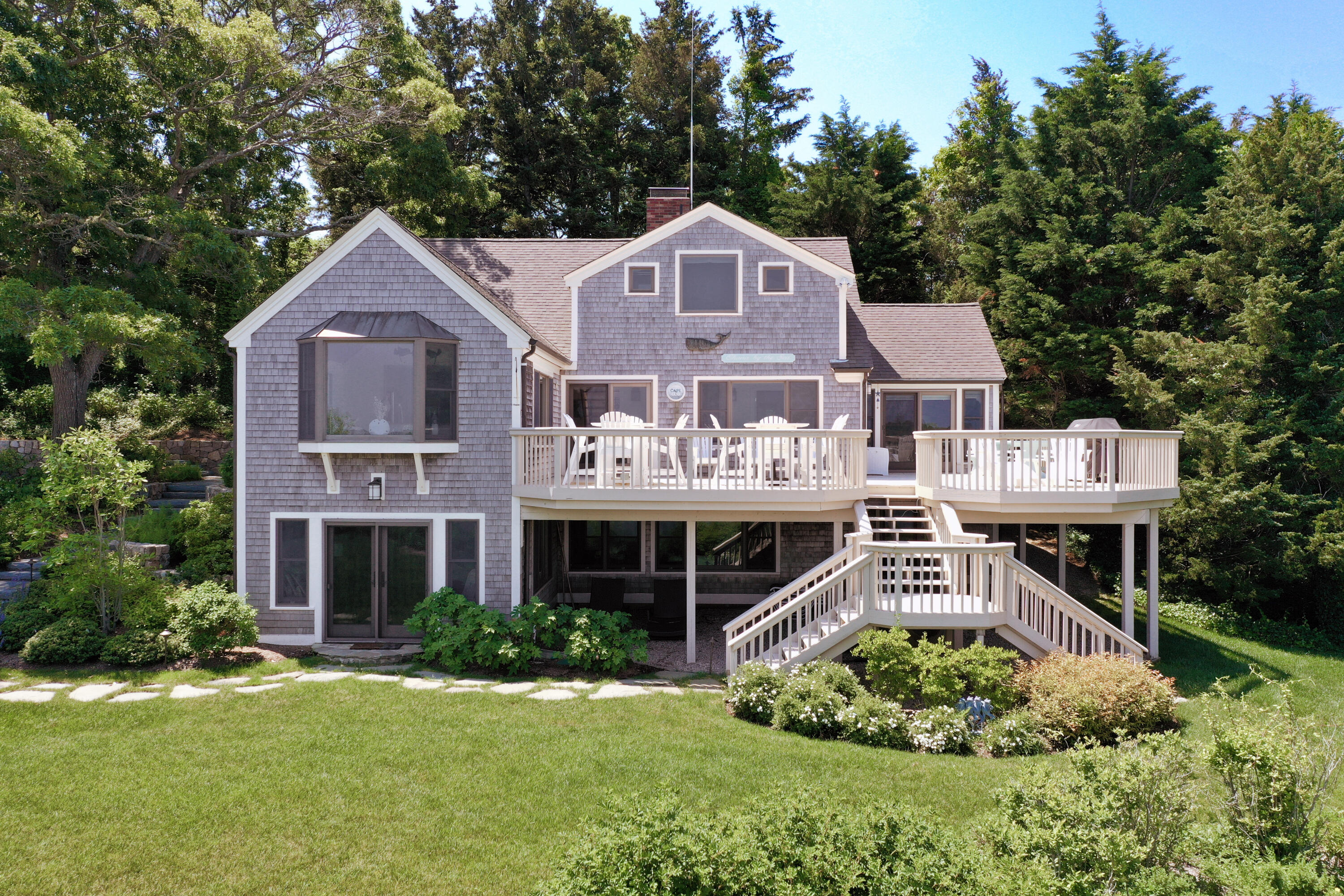 33 Ruggles Road Orleans, MA 02653 - Photo 68 of 80 a front view of a house with a yard and garage