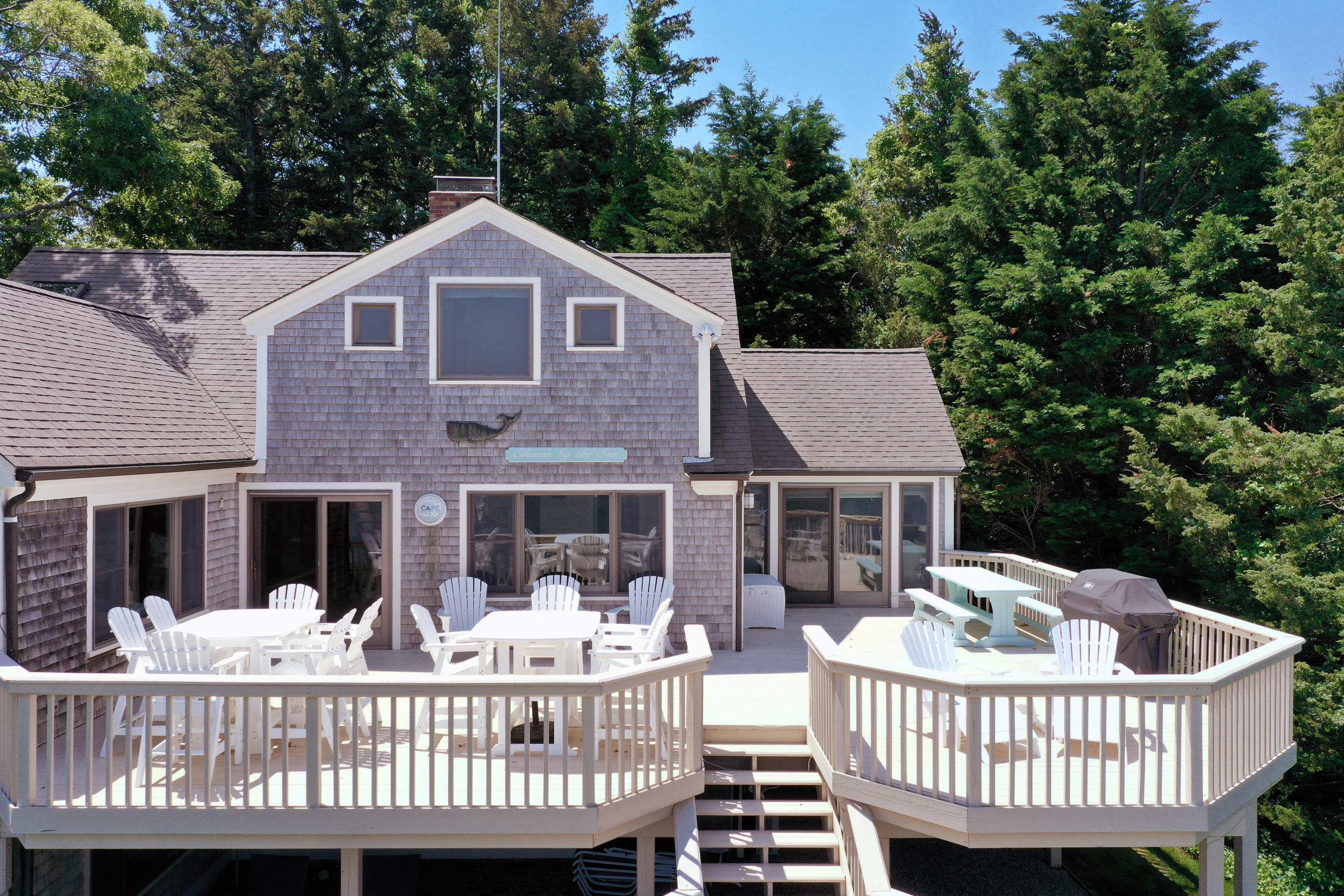 33 Ruggles Road Orleans, MA 02653 - Photo 70 of 80 a view of a house with a wooden deck and furniture