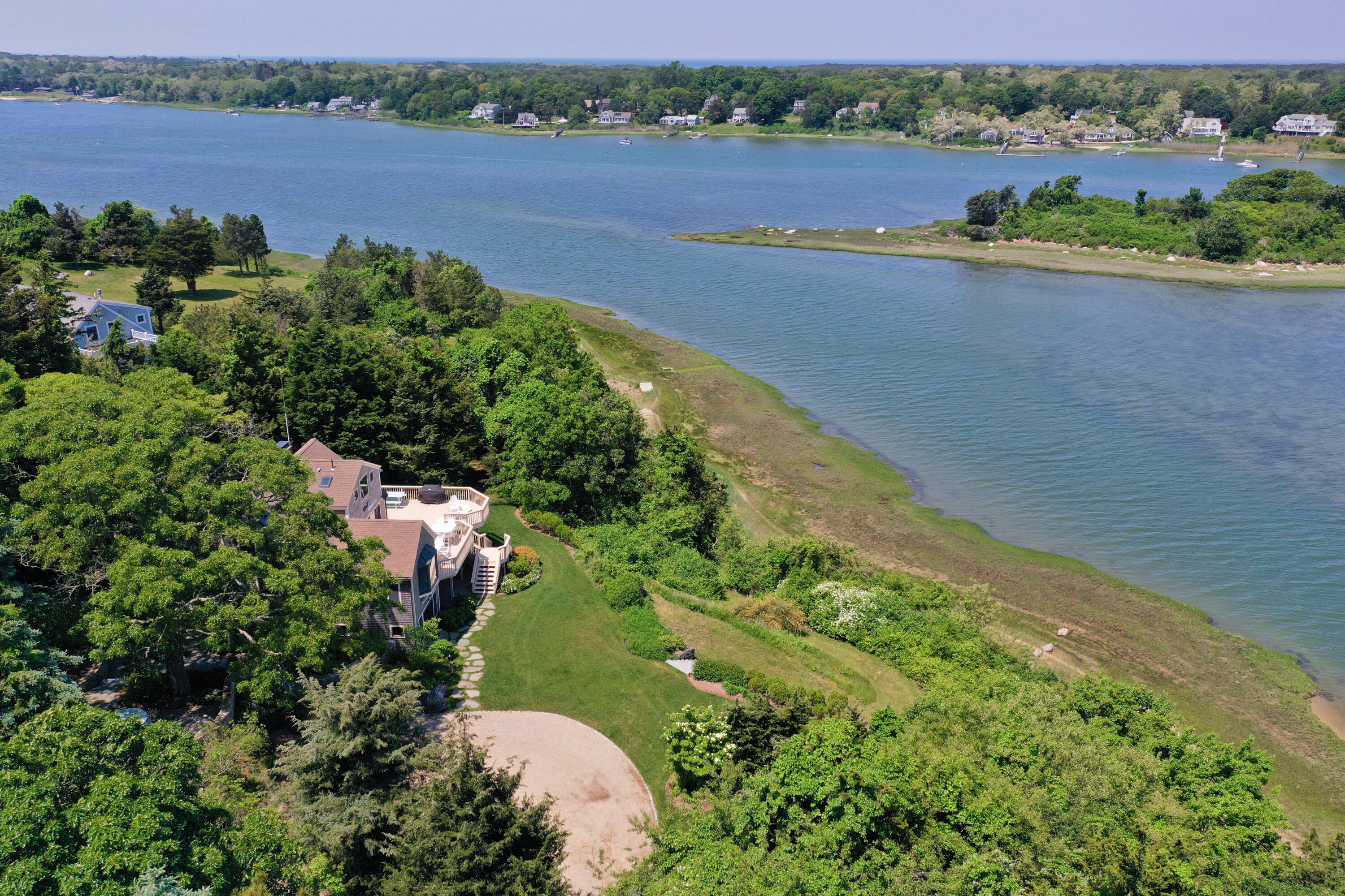 33 Ruggles Road Orleans, MA 02653 - Photo 74 of 80 an aerial view of a house with a garden and lake view