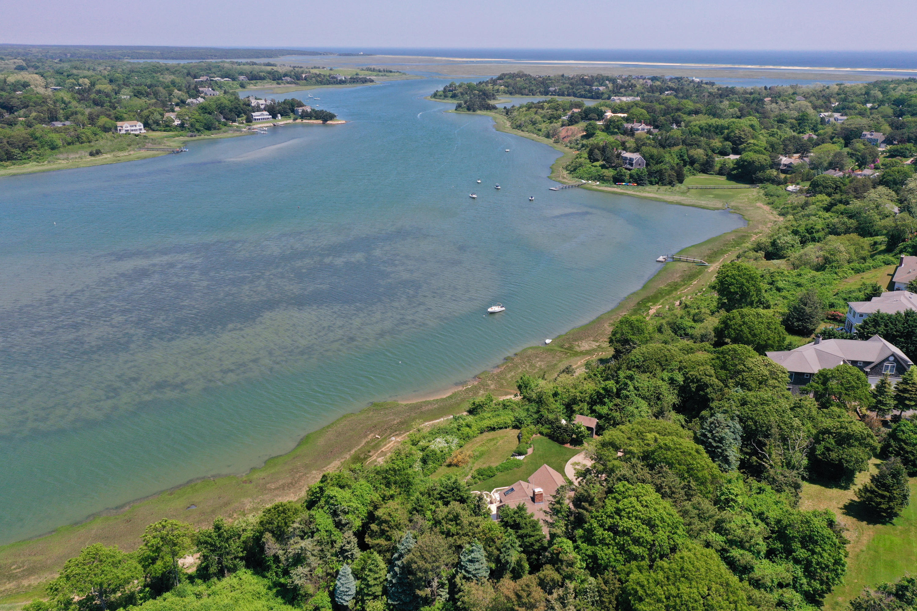 33 Ruggles Road Orleans, MA 02653 - Photo 76 of 80 an aerial view of a houses with a yard and lake view