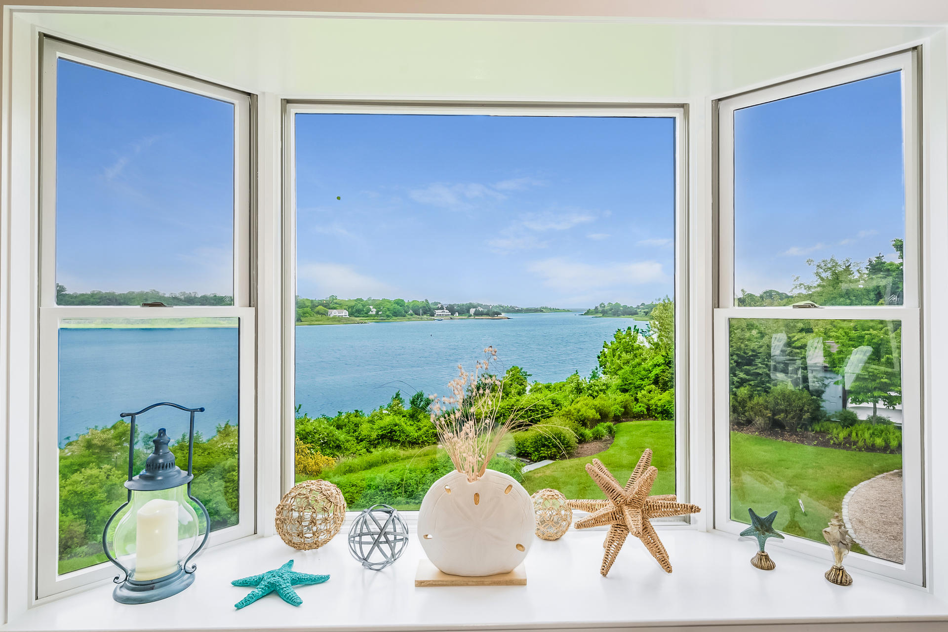 33 Ruggles Road Orleans, MA 02653 - Photo 9 of 80 a view of a porch with chairs and potted plants
