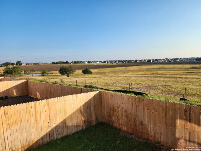 a view of an ocean and with a swimming pool