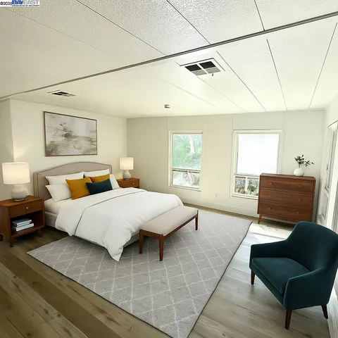 a bedroom with a bed and couch