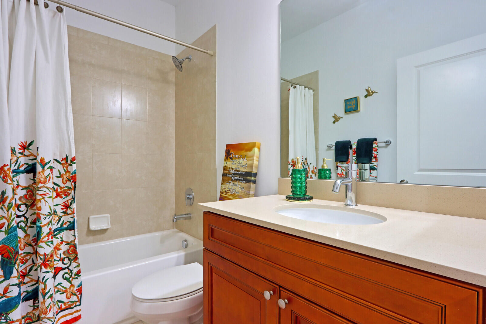 6024 Pine Tree Way Riviera Beach, FL 33410 - Photo 17 of 26 a bathroom with a bathtub shower sink vanity and toilet