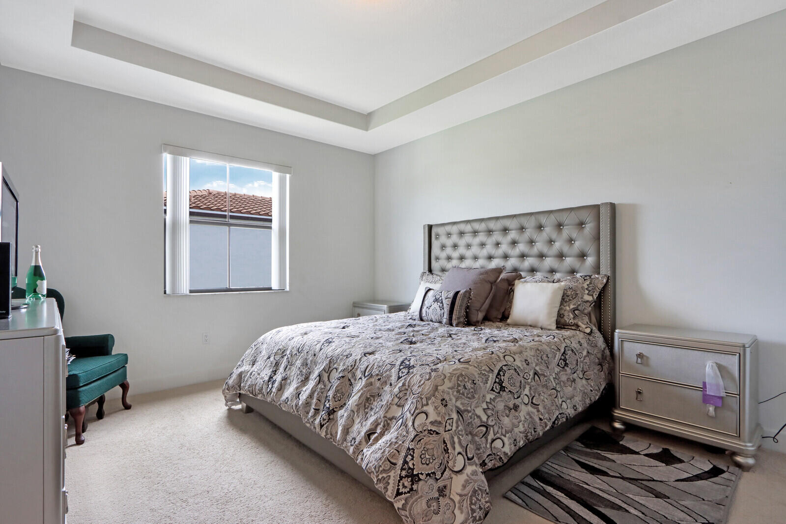 6024 Pine Tree Way Riviera Beach, FL 33410 - Photo 18 of 26 a bedroom with a bed and a window