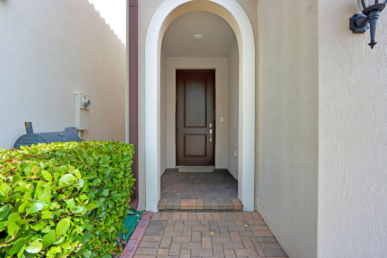 6024 Pine Tree Way Riviera Beach, FL 33410 - Photo 2 of 26 a view of a entryway of the house