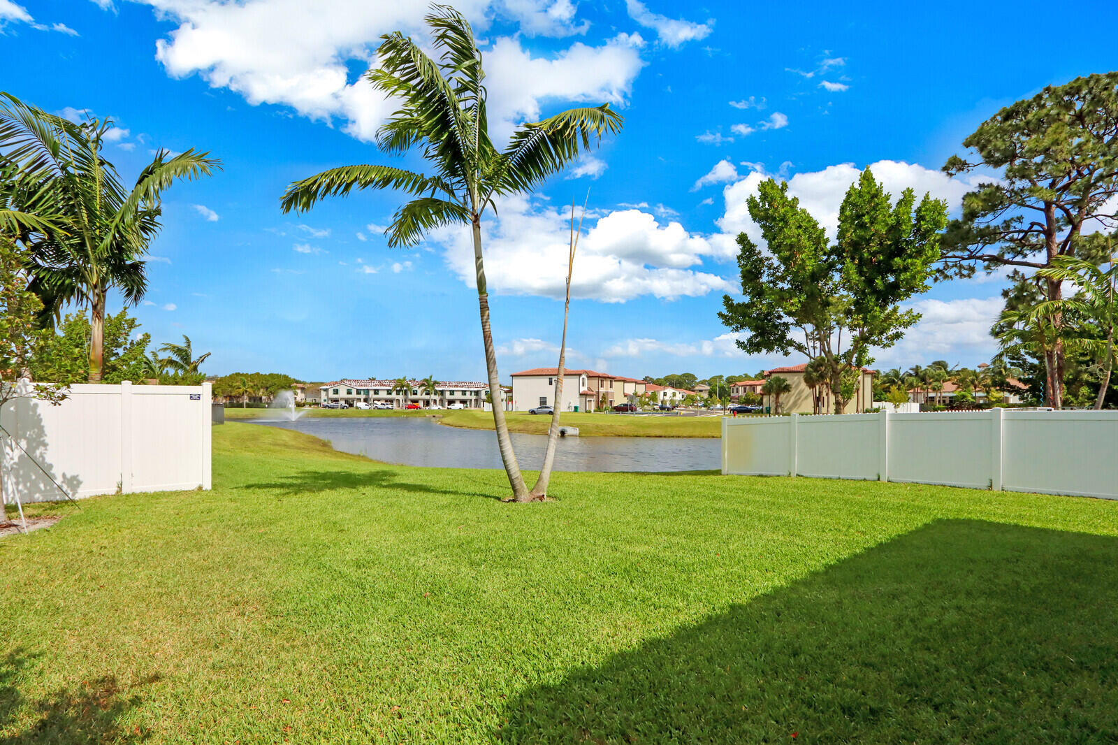 6024 Pine Tree Way Riviera Beach, FL 33410 - Photo 26 of 26 a view of a house with a big yard