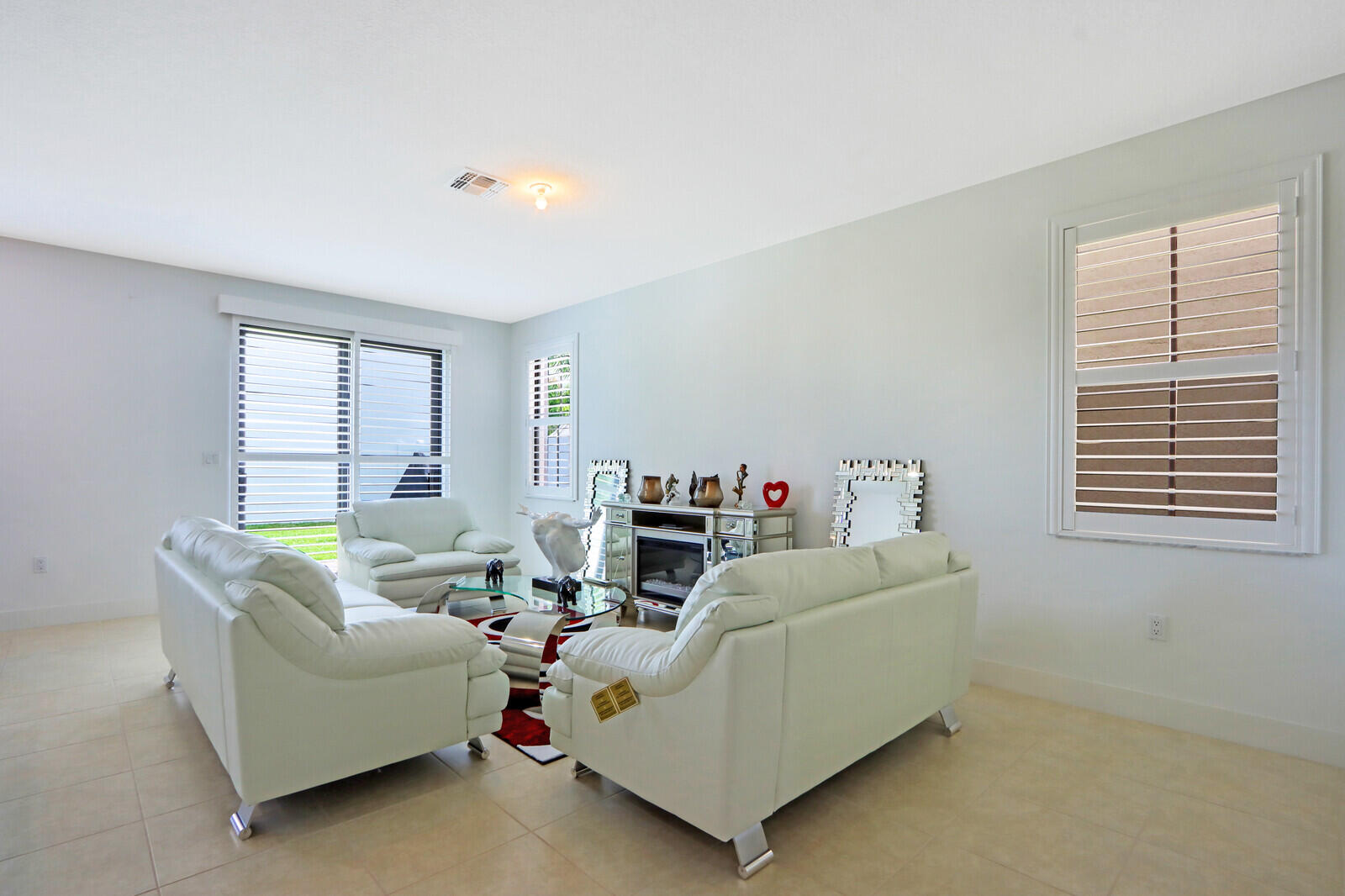 6024 Pine Tree Way Riviera Beach, FL 33410 - Photo 3 of 26 a living room with furniture and a window