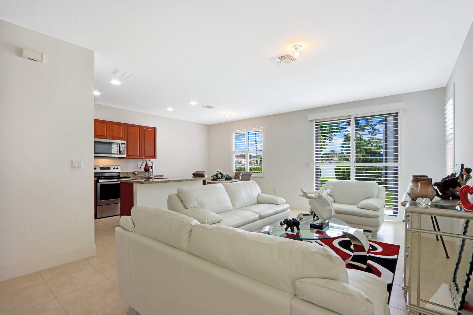 6024 Pine Tree Way Riviera Beach, FL 33410 - Photo 4 of 26 a living room with furniture and a flat screen tv