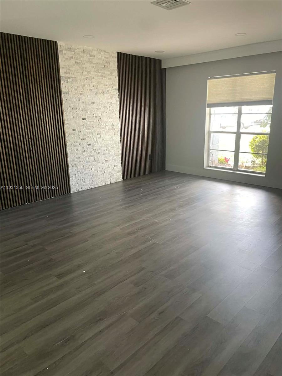 Sandalfoot Cove Boca Raton, FL 33428 - Photo 11 of 12 an empty room with wooden floor and windows