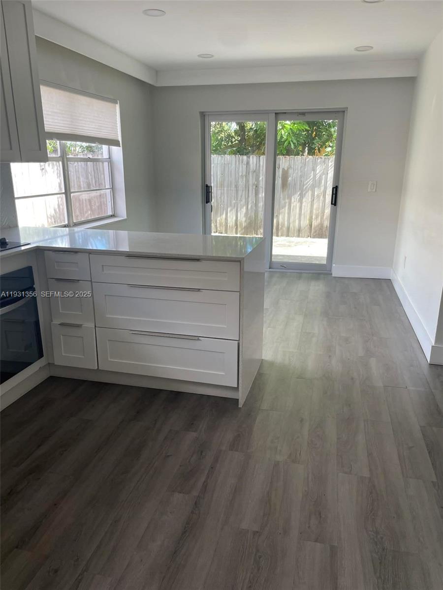 Sandalfoot Cove Boca Raton, FL 33428 - Photo 3 of 12 a view of room with wooden floor and fan
