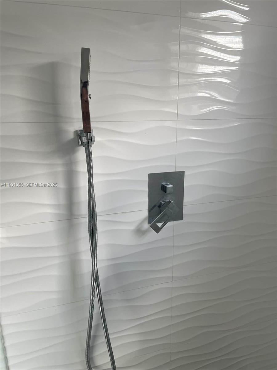 Sandalfoot Cove Boca Raton, FL 33428 - Photo 6 of 12 a bathroom with a shower