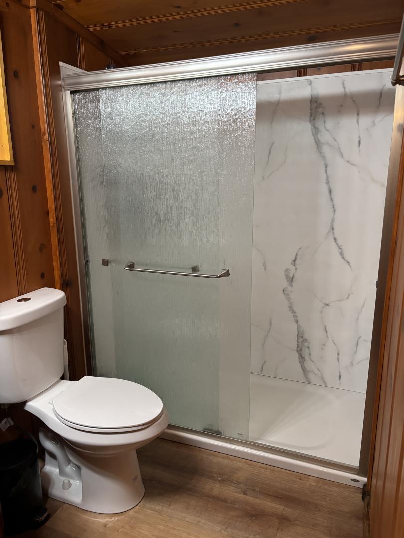 155 McGaffigan Mill Road Boulder Creek, CA 95006 - Photo 12 of 23 a white toilet sitting next to a shower