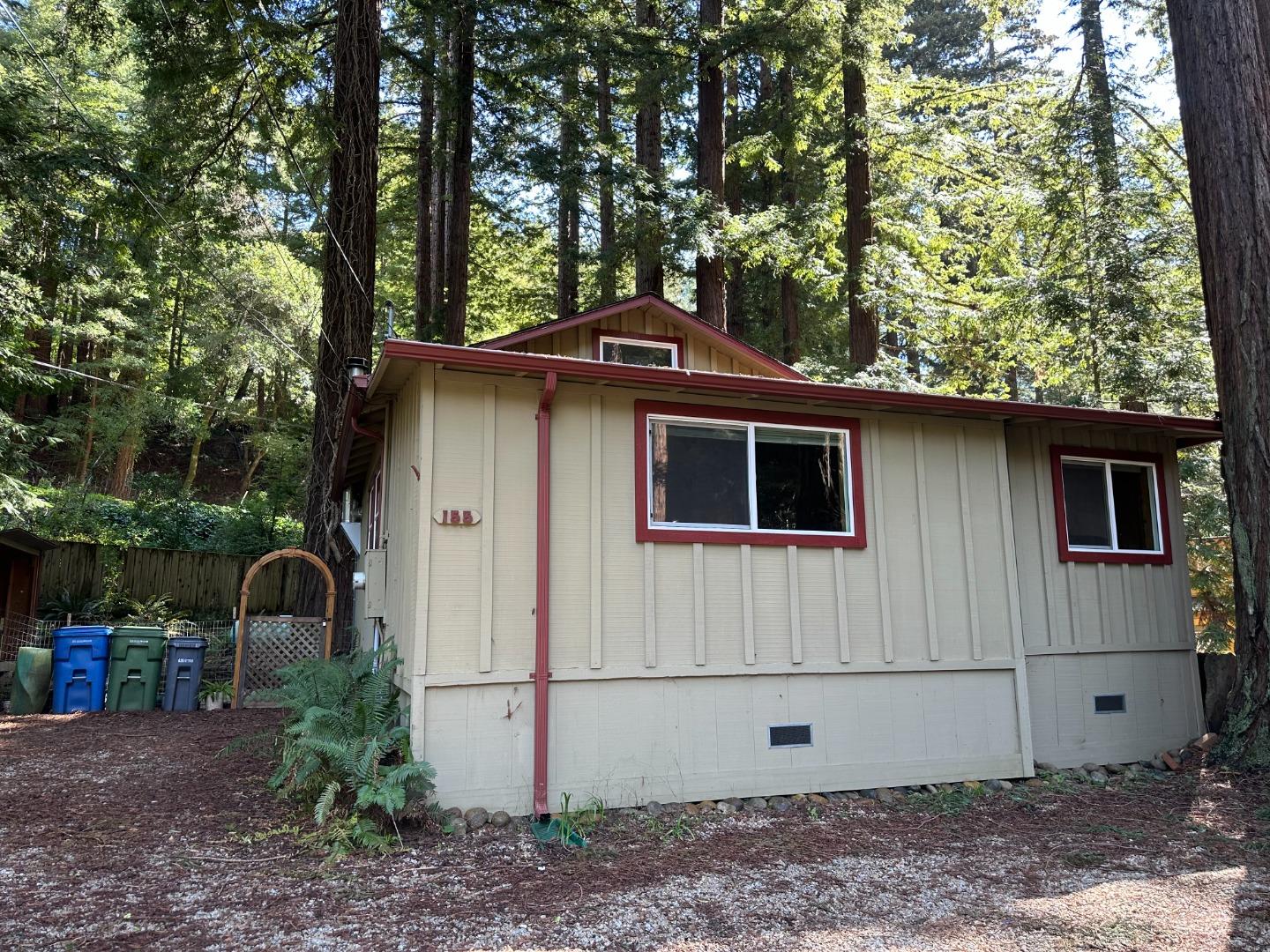 155 McGaffigan Mill Road Boulder Creek, CA 95006 - Photo 14 of 23 a front view of a house with garden