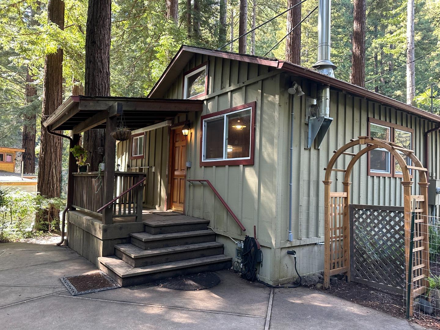 155 McGaffigan Mill Road Boulder Creek, CA 95006 - Photo 15 of 23 a front view of a house with a yard