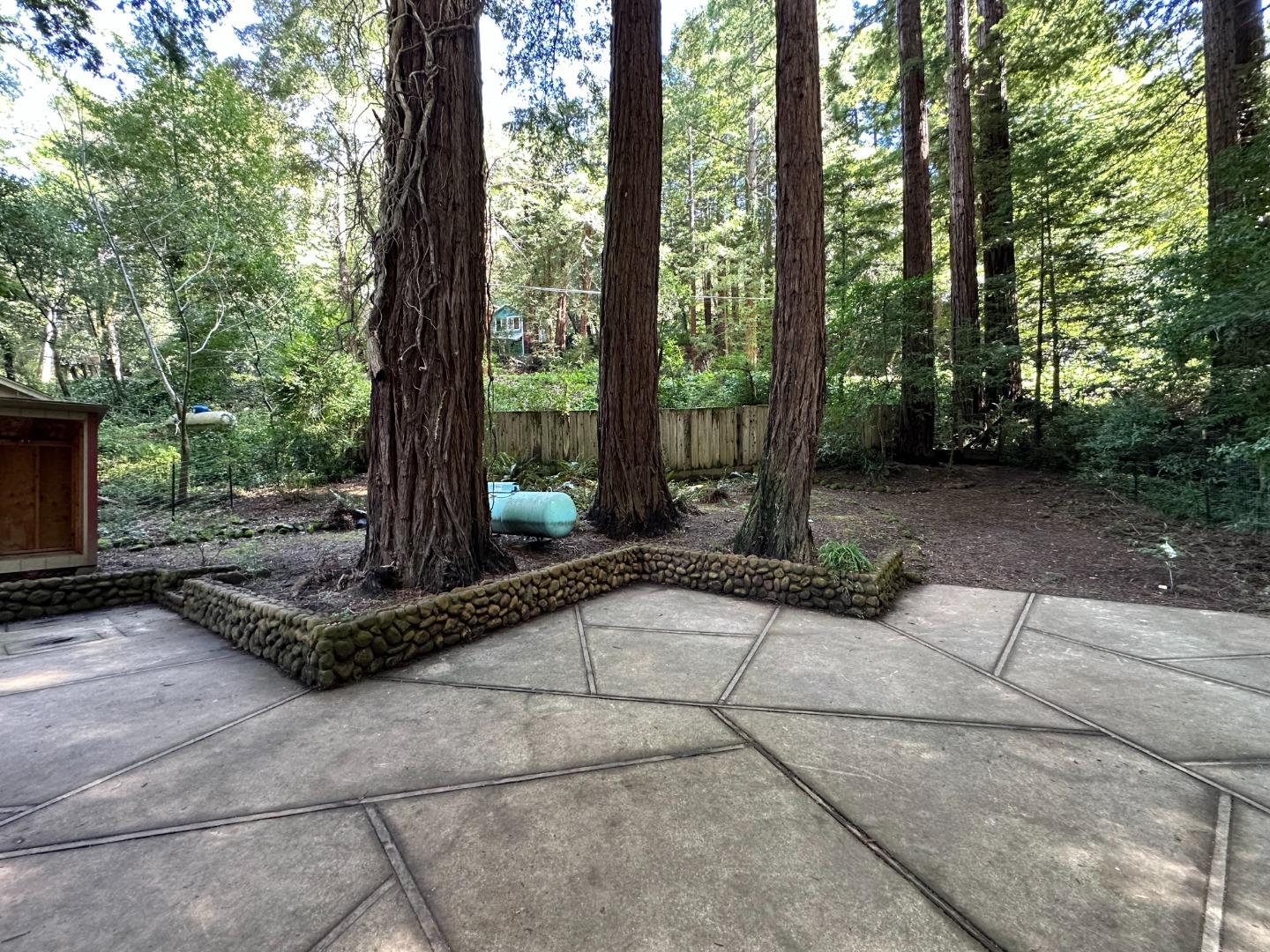 155 McGaffigan Mill Road Boulder Creek, CA 95006 - Photo 21 of 23 a front view of a house with a yard