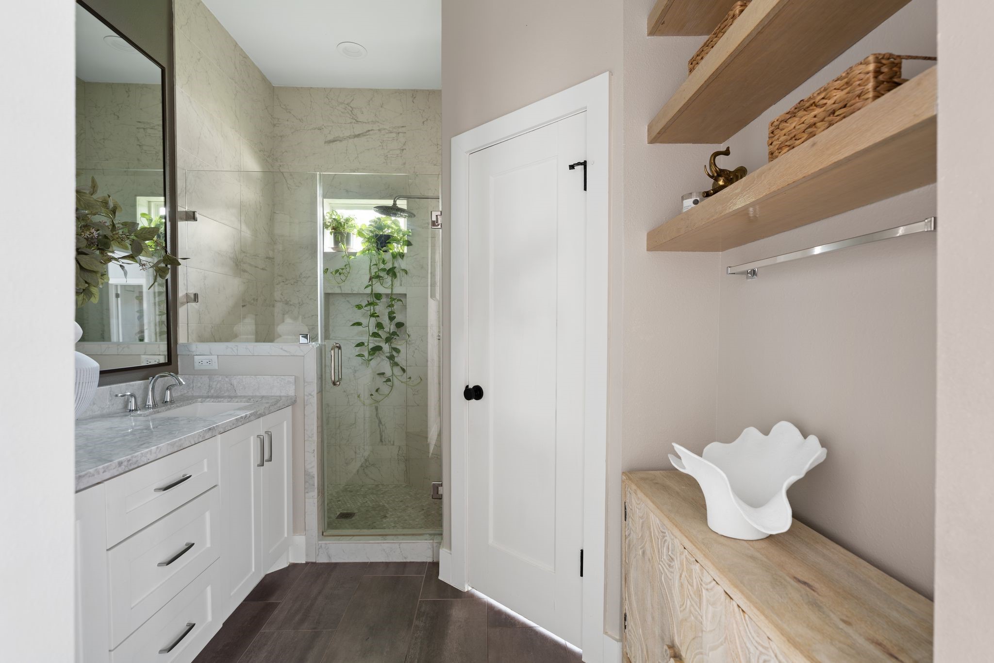 3206 Morrison Street Houston, TX 77009 - Photo 15 of 30 Enjoy sleek floating shelves for stylish storage, a luxurious walk-in shower that invites you to unwind, and a separate water closet.