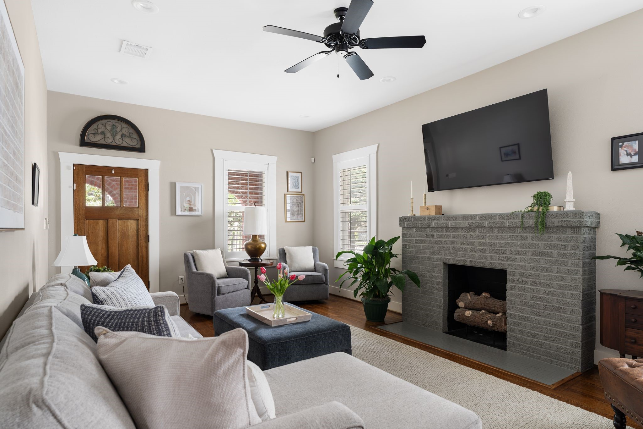 3206 Morrison Street Houston, TX 77009 - Photo 5 of 30 The living room’s mock fireplace serves as a cozy focal point.