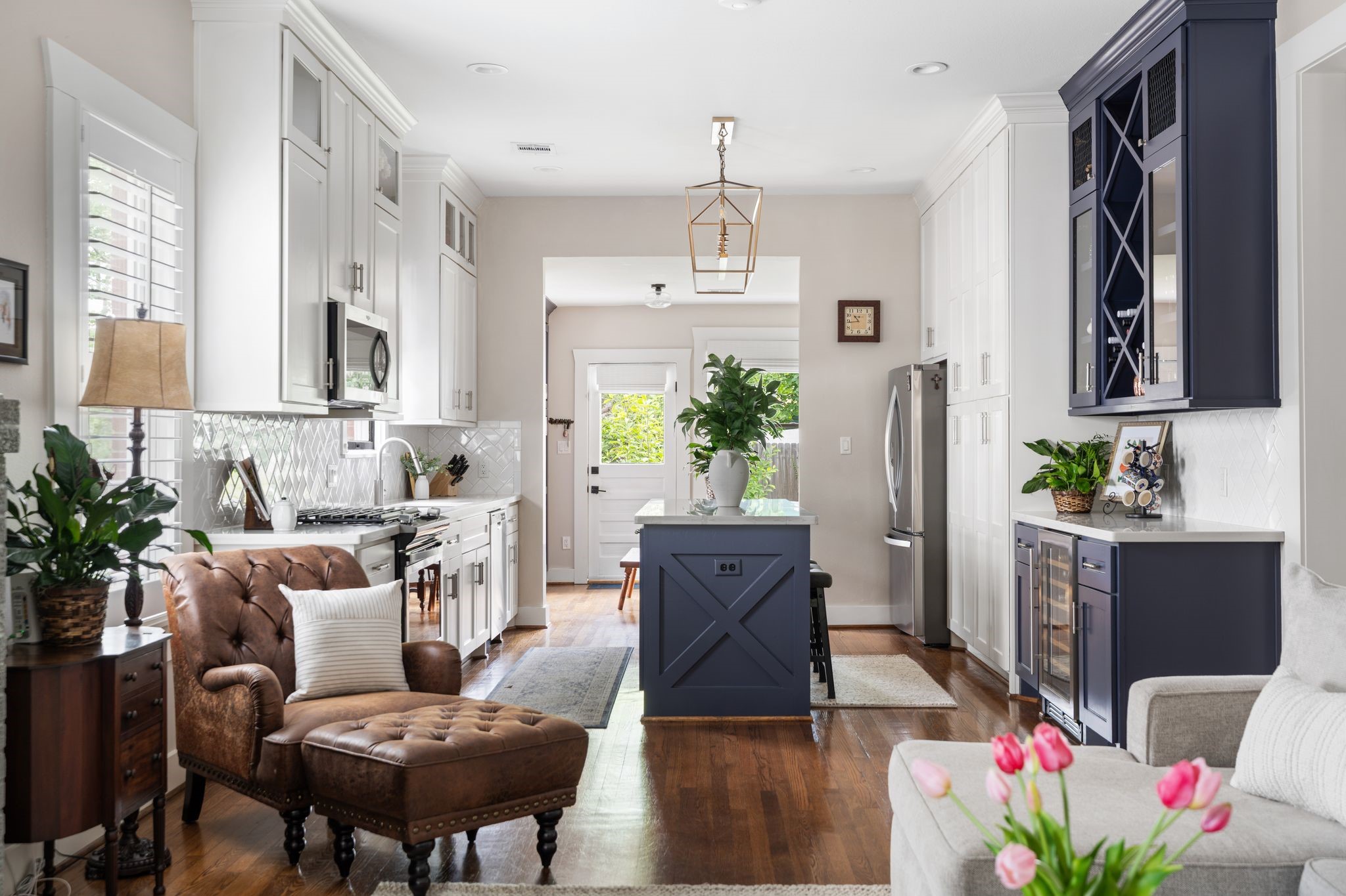 3206 Morrison Street Houston, TX 77009 - Photo 30 of 30 Original hardwood floors, soaring 10-foot ceilings, and custom cabinetry throughout the home speak to its storied past, while the open floor plan infuses the space with an airy, modern feel.