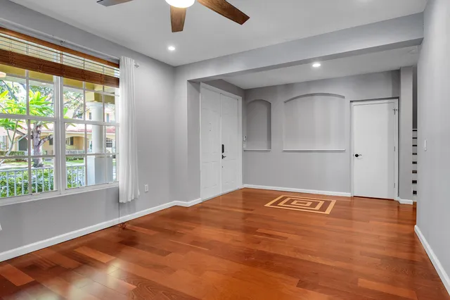 a bathroom with a granite countertop sink a mirror and a shower