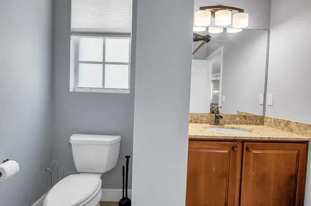 a living room with a bed and a window