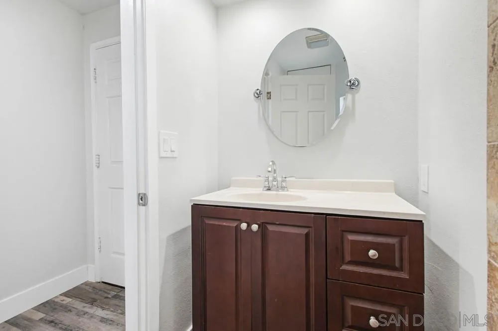 25147 Jack Rabbit Acres, Unit 2 Escondido, CA 92026 - Photo 19 of 39 a bathroom with a sink and a mirror