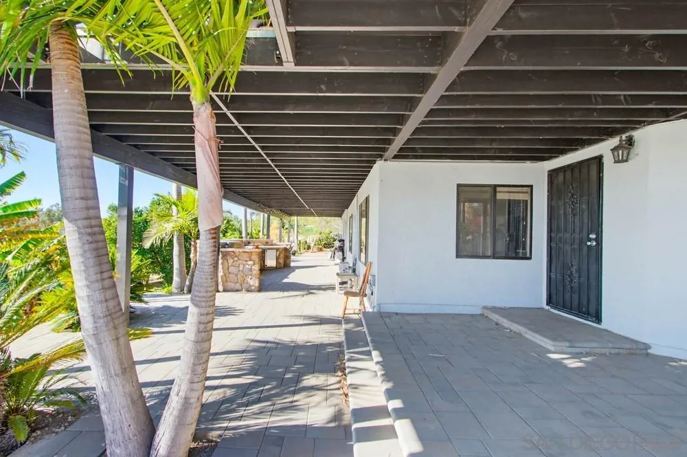 25147 Jack Rabbit Acres, Unit 2 Escondido, CA 92026 - Photo 23 of 39 a patio with table and chairs and potted plants