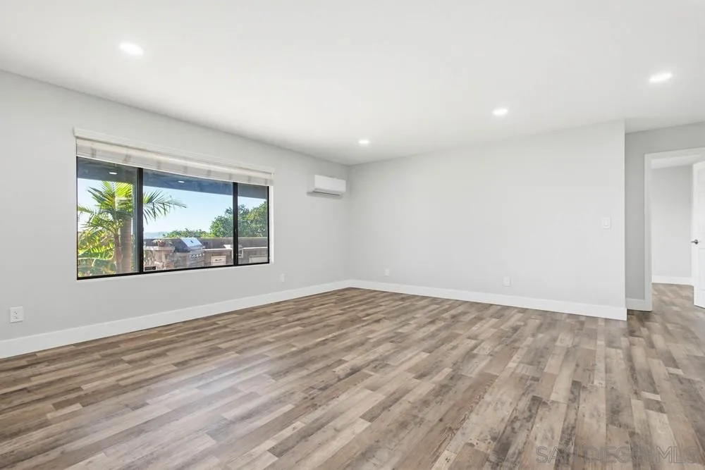 25147 Jack Rabbit Acres, Unit 2 Escondido, CA 92026 - Photo 6 of 39 wooden floor in an empty room with a window