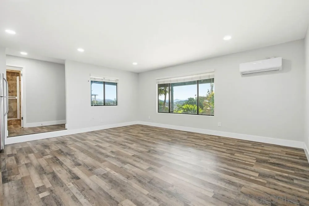 25147 Jack Rabbit Acres, Unit 2 Escondido, CA 92026 - Photo 7 of 39 a view of an empty room with window and wooden floor